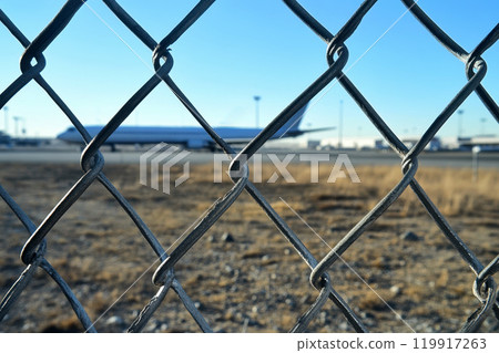 an airport or restricted zone restricted area with chain fence on white. 119917263