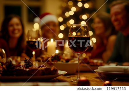 Photo of nice joyful family people drinking wine and having Christmas dinner. 119917533