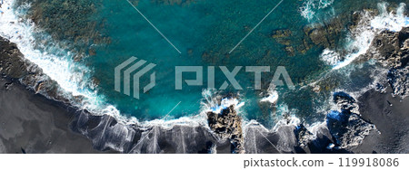 Atlantic ocean with waves and black basalt sand and rocks, view from above Atlantic ocean with waves and black basalt sand and rocks, view from above 119918086