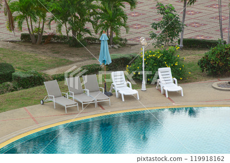 Empty chair and swimming pool 119918162
