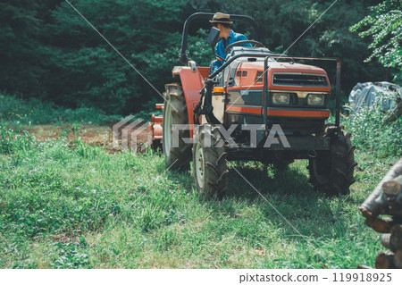 Tractor and farmer Tractor and farmer 119918925