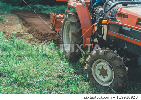 Tractor and farmer Tractor and farmer 119918928