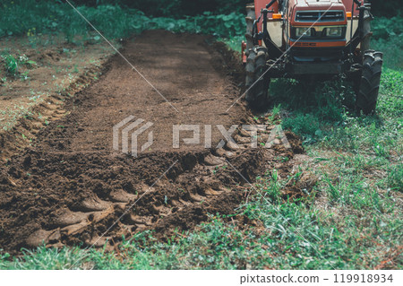 Tractor tire marks in the field Tractor tire marks in the field 119918934