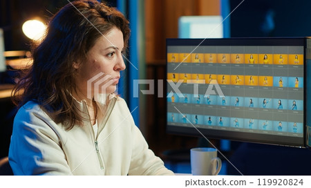 Photographer using professional photo editing tools on PC display. Photo editor utilizing high tech photographs retouching application to make adjustments using computer screen, camera A Photographer using professional photo editing tools on PC display. Photo editor utilizing high tech photographs retouching application to make adjustments using computer screen, camera A 119920824
