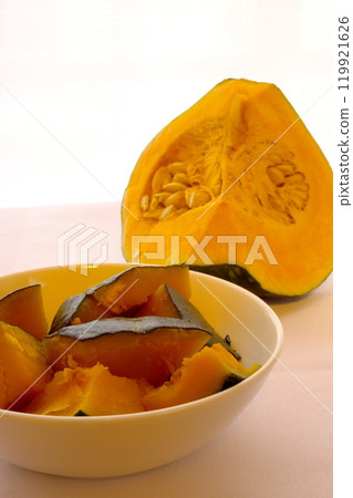 Cut pumpkin and boiled pumpkin served in a white dish Cut pumpkin and boiled pumpkin served in a white dish 119921626