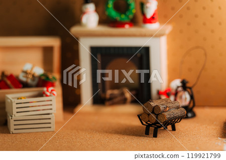 Interior view of a fireplace decorated with Christmas ornaments 119921799