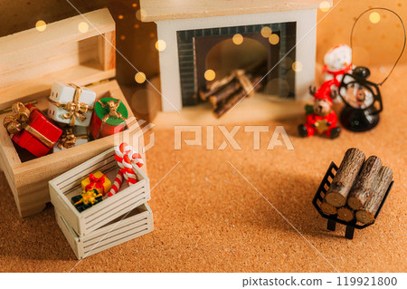 A warm interior scene with a fireplace and Christmas presents A warm interior scene with a fireplace and Christmas presents 119921800
