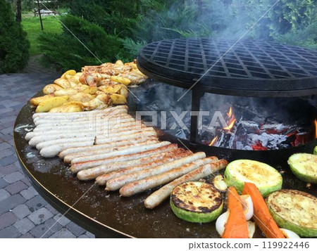 Outdoor Barbecue with Grilled Sausages and Vegetables Outdoor Barbecue with Grilled Sausages and Vegetables 119922446