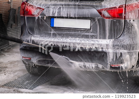 SUV Being Washed at Car Wash 119923523