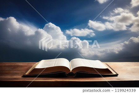 open bible on cloudy sky background concept religion 119924339