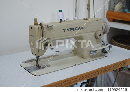 SURABAYA, INDONESIA JULY 01, 2024 - Sewing machine in the workshop. Sewing machine on the table 119924526