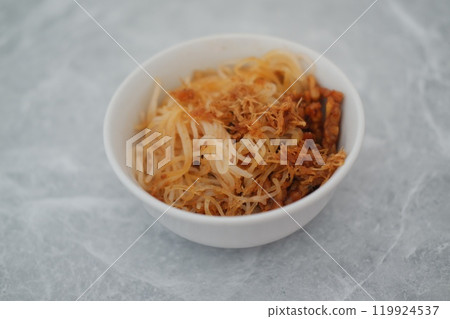 Fried vermicelli noodles in white bowl background 119924537
