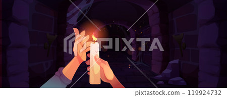 Hands holding burning candle in medieval dungeon 119924732