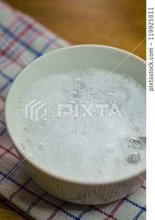 foaming solution of baking soda, vinegar and soap to clean tough stains in bowl. High quality photo 119925811