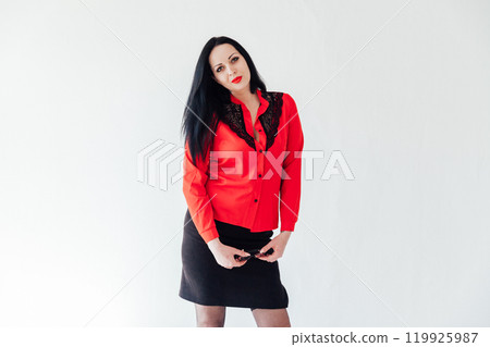 Portrait of a beautiful brunette woman in business clothes 119925987