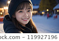 Beautiful Asian woman smiling at ski resort 119927196