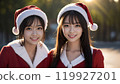 Two beautiful Asian women in Santa costumes 119927201