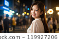 Beautiful Asian woman walking in the city at night 119927206