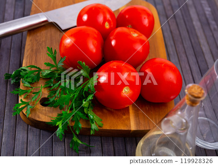 Fresh red tomatoes on wooden table Fresh red tomatoes on wooden table 119928326