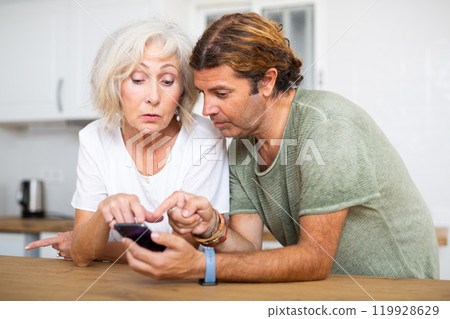 Husband help an elderly wife learn how to use smartphone Husband help an elderly wife learn how to use smartphone 119928629