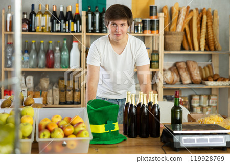 Seller in a leprechaun hat in a supermarket 119928769