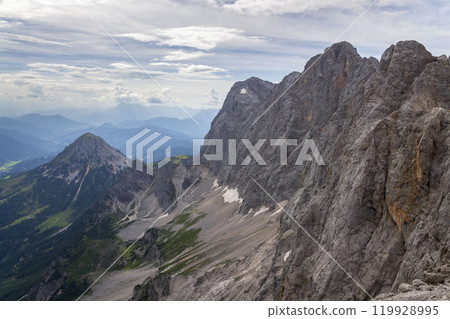 Dachstein Sudwand with Torstein, Mitterspitz, Hoher Dachstein and Dirndl mountains in Norhern Limesteone Alps, Austria, sunny summer day Dachstein Sudwand with Torstein, Mitterspitz, Hoher Dachstein and Dirndl mountains in Norhern Limesteone Alps, Austria, sunny summer day 119928995