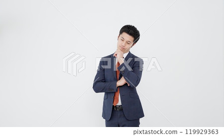 Thinking Asian businessman Thinking Asian businessman 119929363