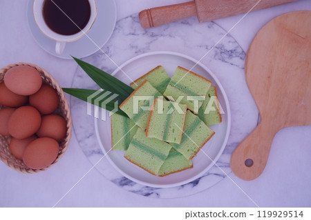 pandan cake on a white plate. Selective focus. 119929514