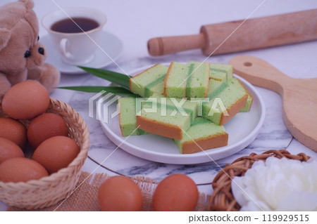 pandan cake on a white plate. Selective focus. pandan cake on a white plate. Selective focus. 119929515