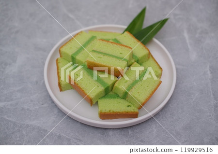 pandan cake on a white plate. Selective focus. pandan cake on a white plate. Selective focus. 119929516