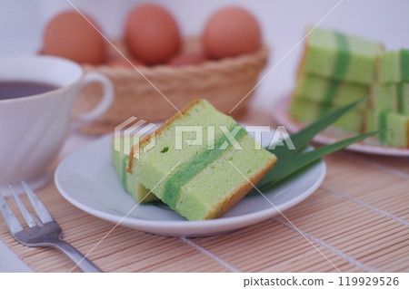 pandan cake on a white plate. Selective focus. pandan cake on a white plate. Selective focus. 119929526