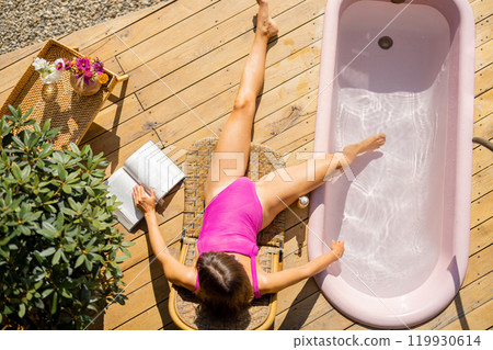 Top View Sunbathing on Wooden Deck 119930614