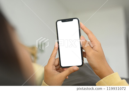 Close up person holding smartphone with white screen for app display 119931072