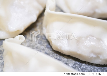 Image of wings being made from frozen dumplings (stock photo) Image of wings being made from frozen dumplings (stock photo) 119931618