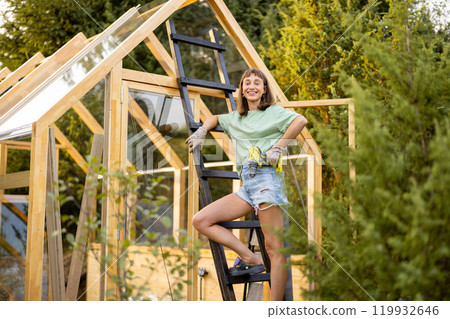 Female Carpenter with Power Drill 119932646