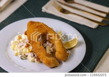 Traditional Christmas dinner in Czech Republic - fried carp with potato salad 119932873