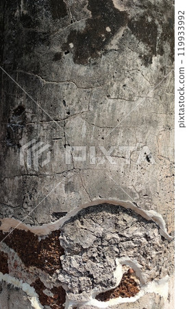 Close-up of textured concrete surface with cracks and peeling paint. 119933992