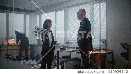 Robbery or murder in office: Female forensic scientist packs gun in zip lock bag, talks to male detective 119934540