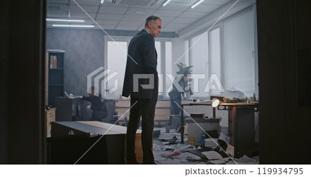 Office robbery case: Crime investigation team working at crime scene 119934795