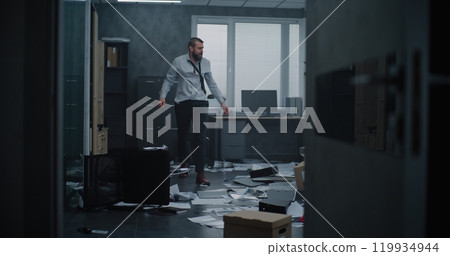 Full shot of aggressive and angry office worker yelling, destroying office room Full shot of aggressive and angry office worker yelling, destroying office room 119934944