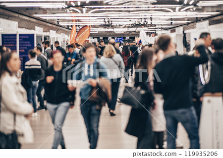 Abstract blurred people at exhibition hall of expo event trade show. Business convention show or job fair. Business concept background 119935206
