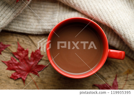 Cup of delicious hot chocolate on wooden table background. 119935395