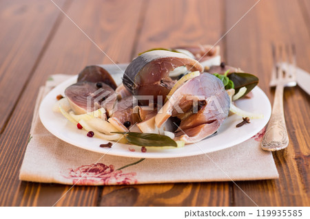 lightly salted mackerel with onions and spices, in a plate 119935585