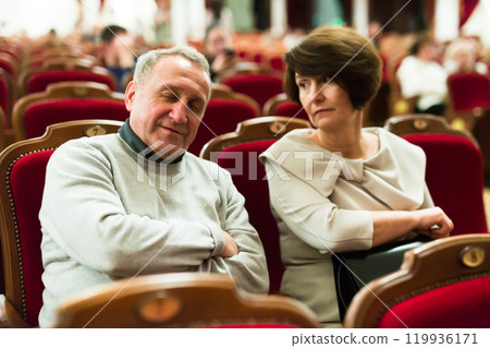 Caucasian senor sleeping in the theater hall 119936171