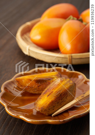 Image of a ripe brush persimmon Image of a ripe brush persimmon 119936239