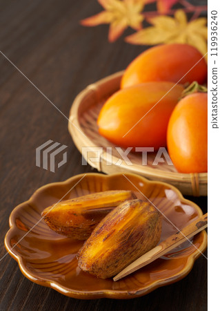 Image of a ripe brush persimmon Image of a ripe brush persimmon 119936240