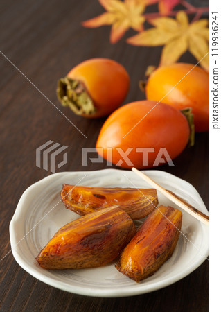 Image of a ripe brush persimmon Image of a ripe brush persimmon 119936241