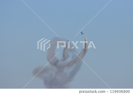 Blue Impulse exhibition flight: Blue Impulse trailing smoke in clear skies: Corkscrew 119936800