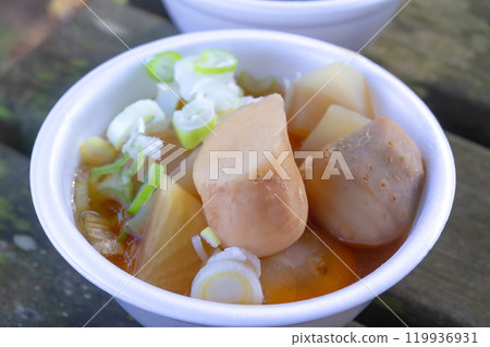 Pot of potato stew placed on a wooden chair Pot of potato stew placed on a wooden chair 119936931