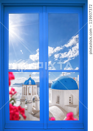 Oia village with churches through blue window on Santorini island in Greece 119937372